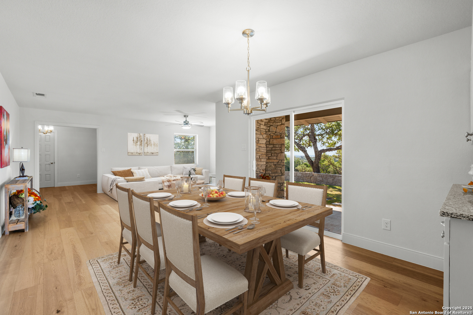 935 Spring Branch Road Spring Branch, TX 78070 - Photo 9 of 48 a view of a dining room with furniture window and wooden floor