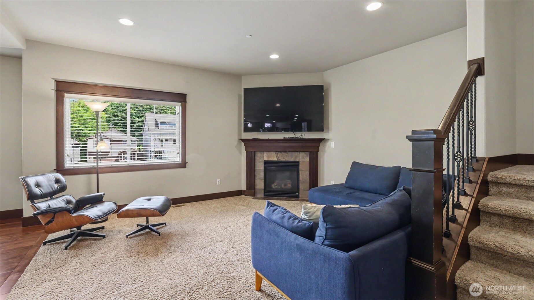 1357 Elma Place Northeast Renton, WA 98059 - Photo 3 of 40 a living room with furniture a fireplace and a flat screen tv