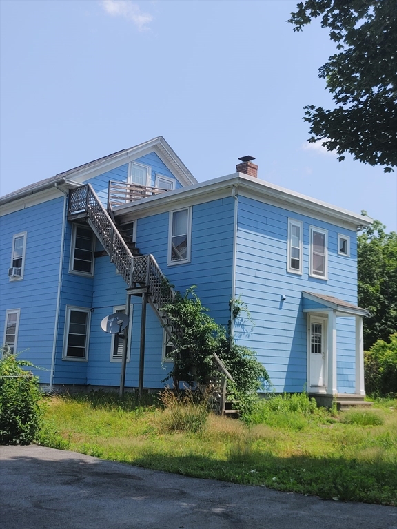6 Wall Street Webster, MA 01570 - Photo 2 of 2 a view of a house with a yard