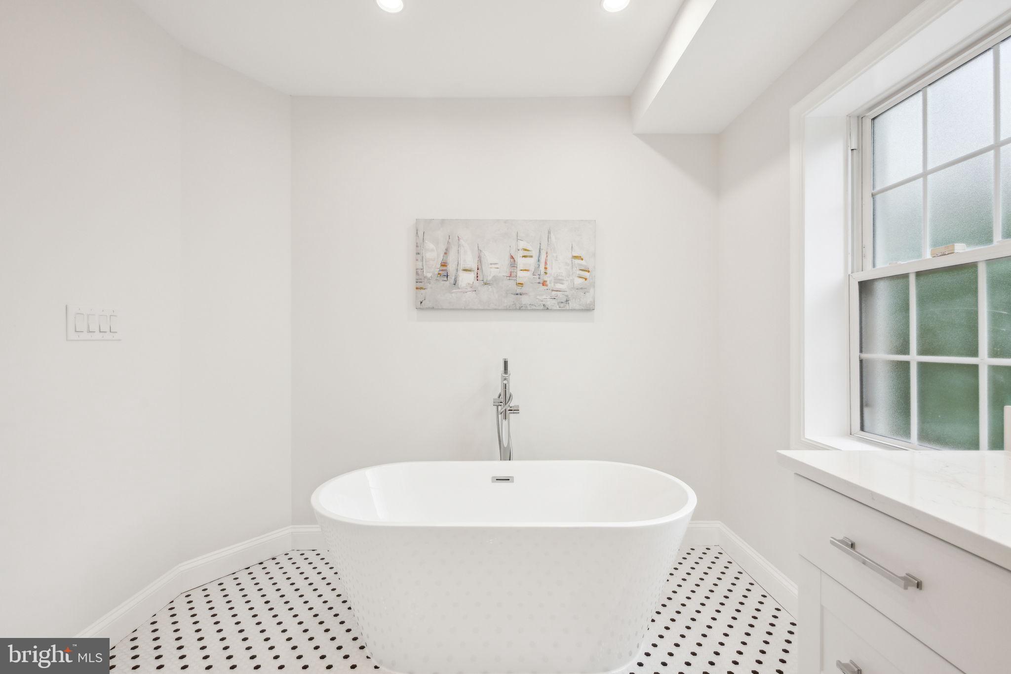 2444 Tunlaw Road Northwest Washington, DC 20007 - Photo 19 of 38 a bathroom with a sink and a window