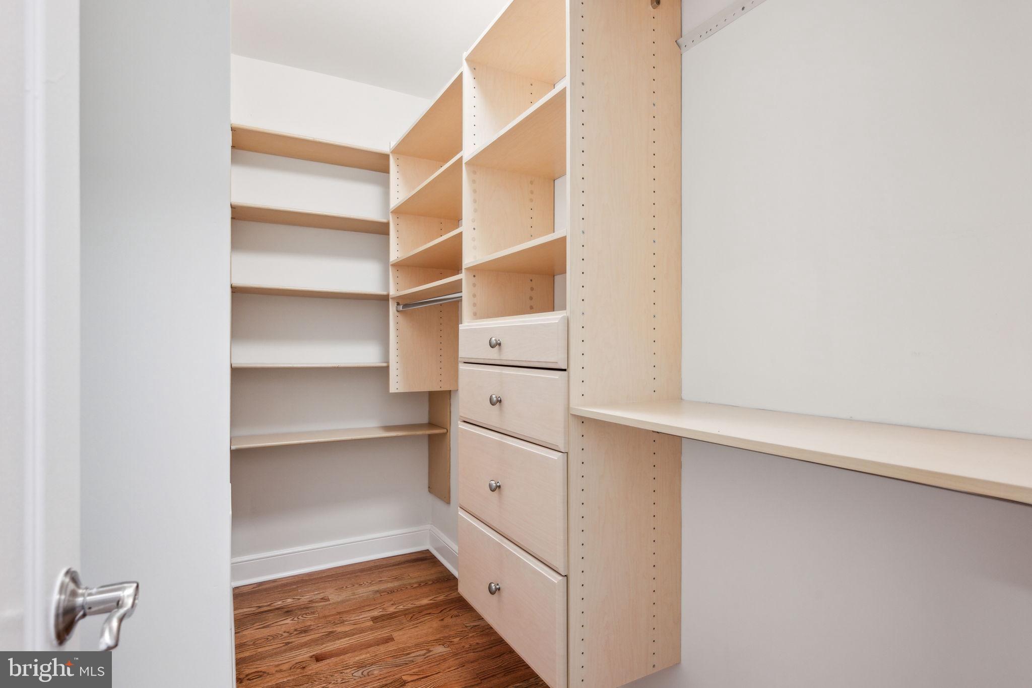 2444 Tunlaw Road Northwest Washington, DC 20007 - Photo 22 of 38 a view of walk in closet with empty racks