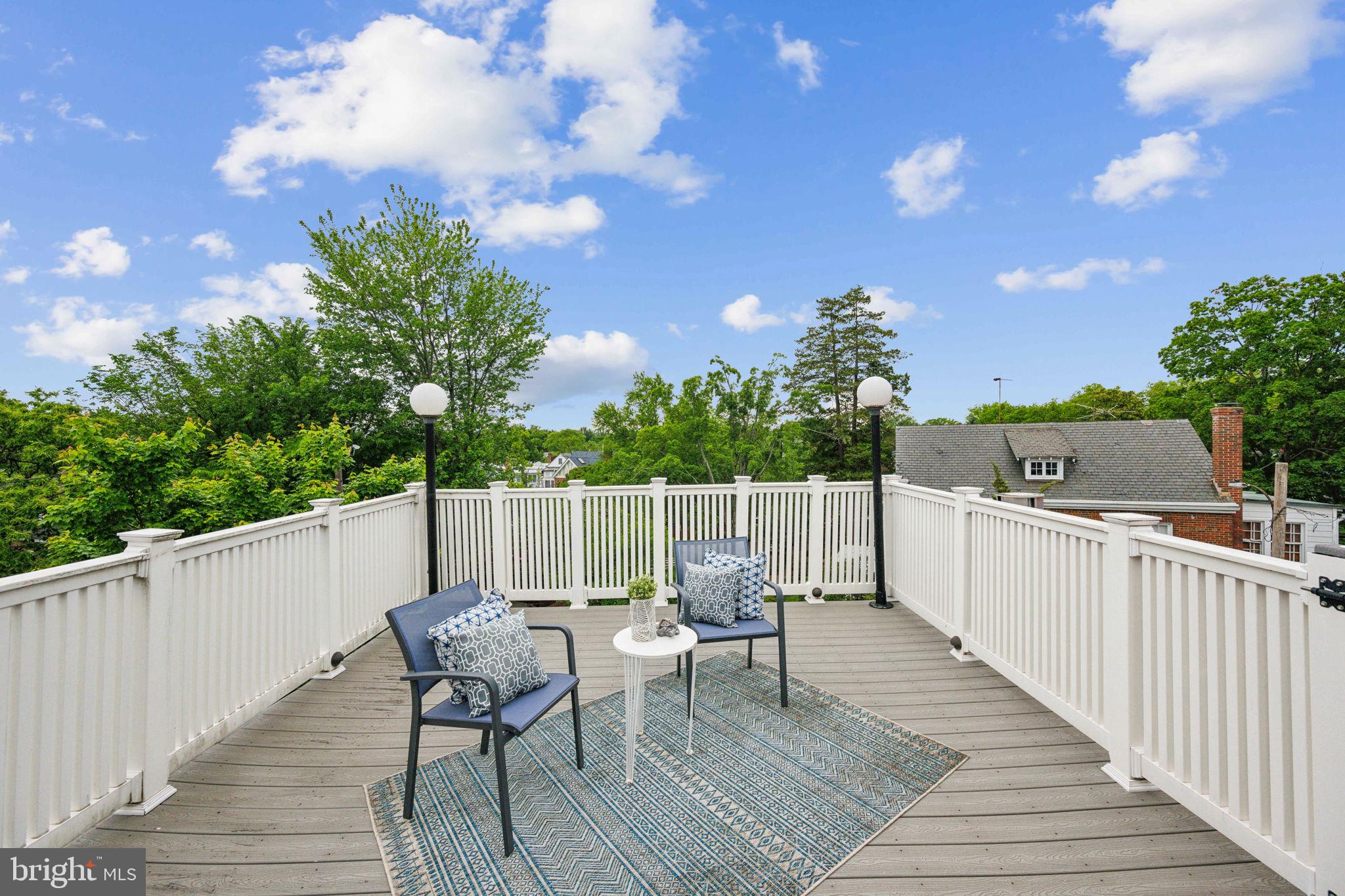 2444 Tunlaw Road Northwest Washington, DC 20007 - Photo 26 of 38 a view of balcony with wooden floor and outdoor seating