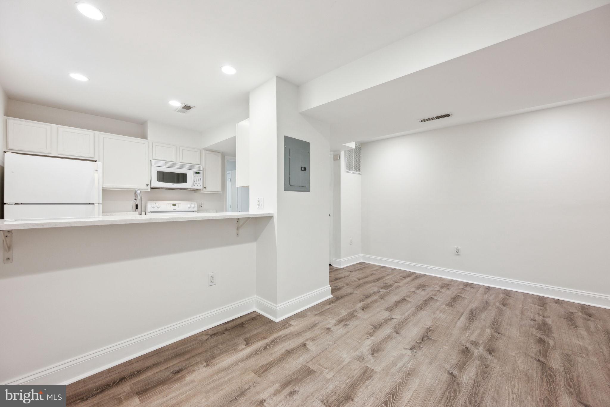 2444 Tunlaw Road Northwest Washington, DC 20007 - Photo 30 of 38 a view of kitchen with wooden floor