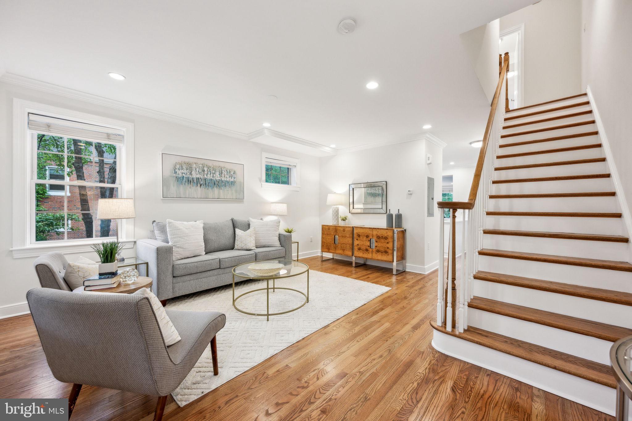 2444 Tunlaw Road Northwest Washington, DC 20007 - Photo 3 of 38 a living room with furniture and a wooden floor