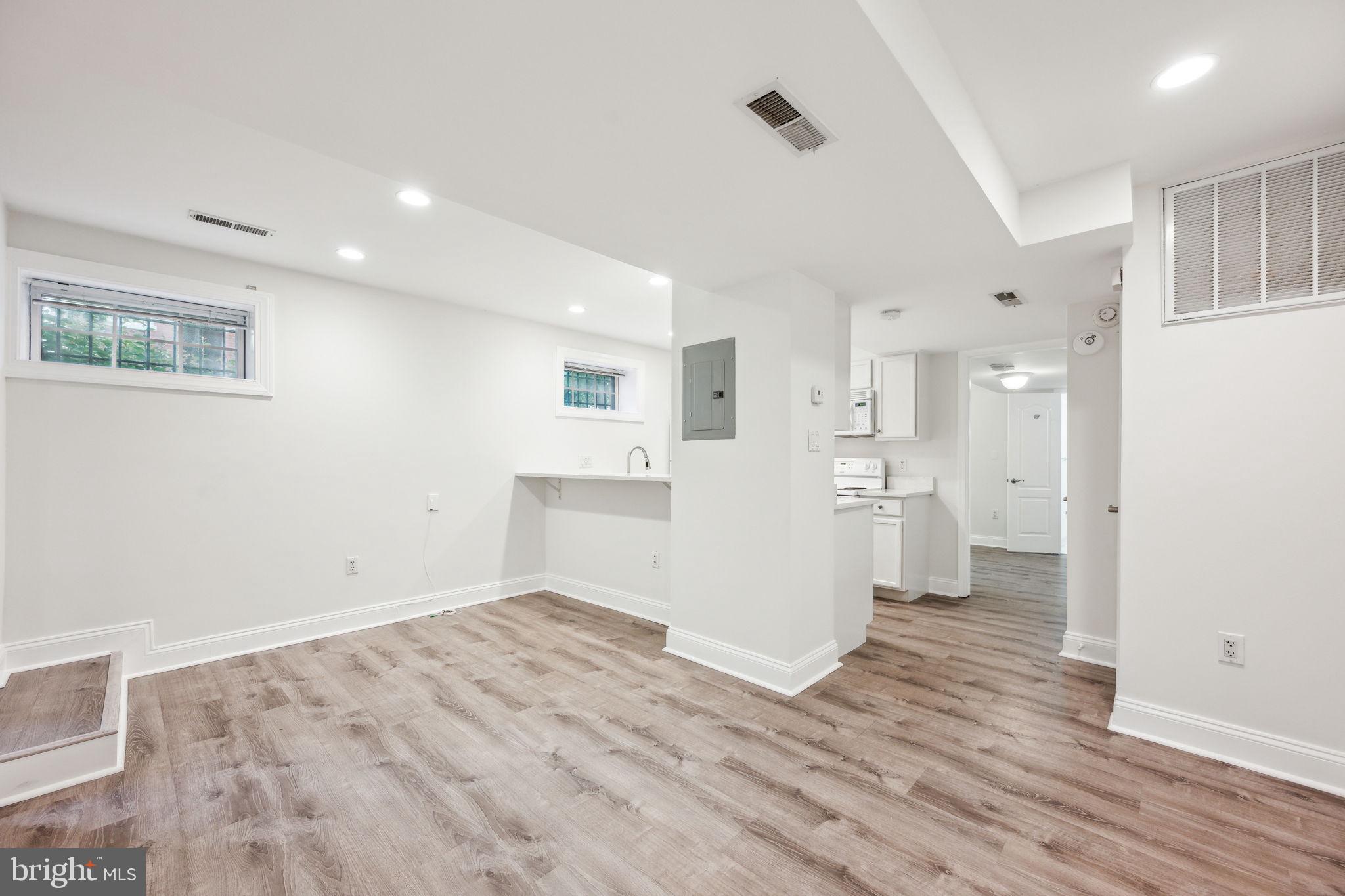 2444 Tunlaw Road Northwest Washington, DC 20007 - Photo 31 of 38 a view of a kitchen with wooden floor and a window