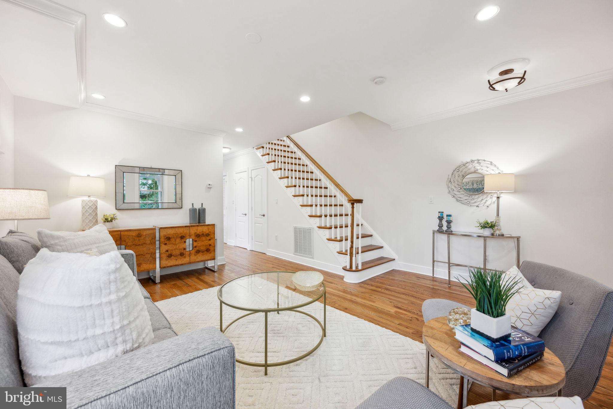 2444 Tunlaw Road Northwest Washington, DC 20007 - Photo 5 of 38 a living room with furniture and wooden floor