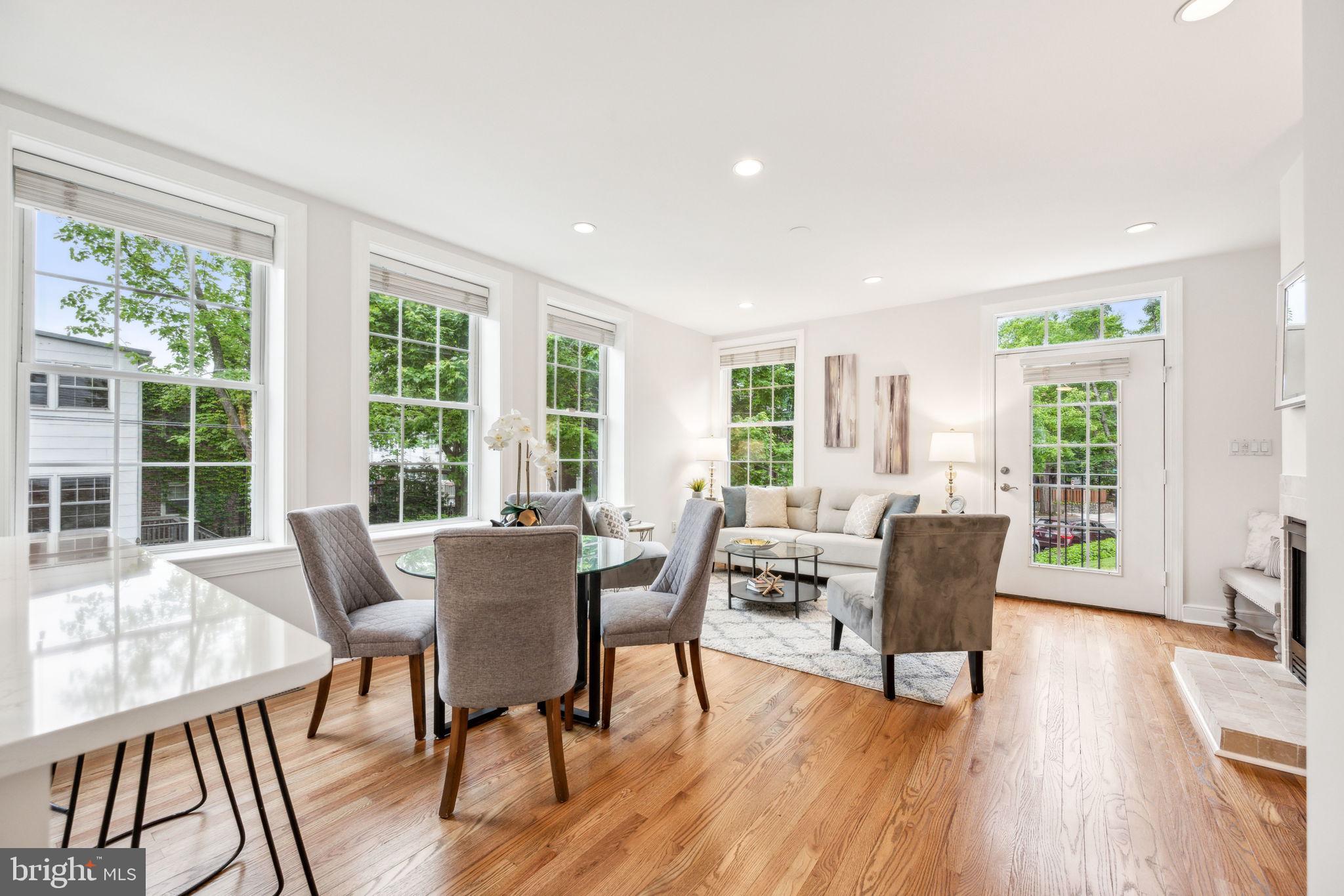 2444 Tunlaw Road Northwest Washington, DC 20007 - Photo 10 of 38 a view of a dining room with furniture window and wooden floor