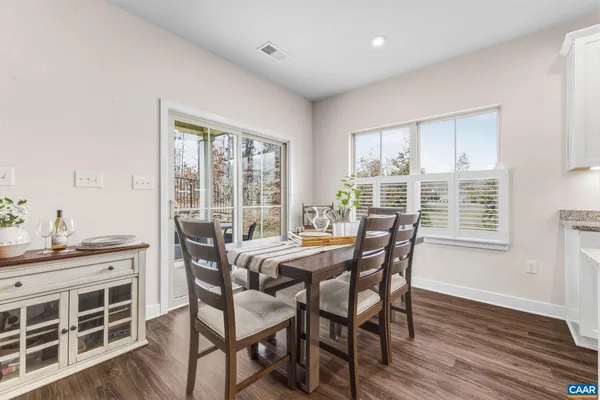 a dining room with table and chairs
