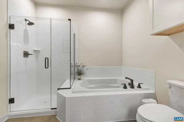 a bedroom with a bed and a view of bathroom