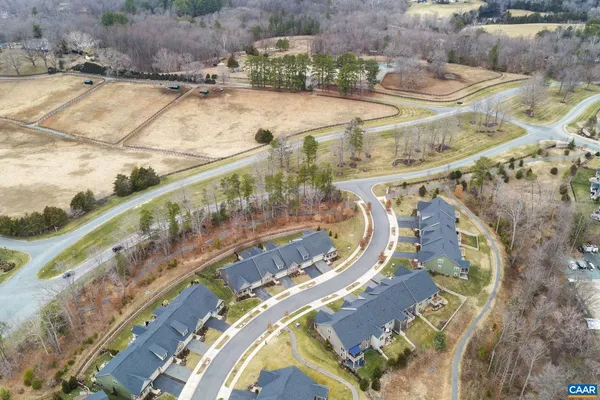 a aerial view of a house with a yard