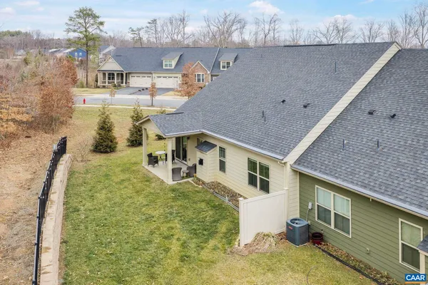 a view of a patio with a table and chairs