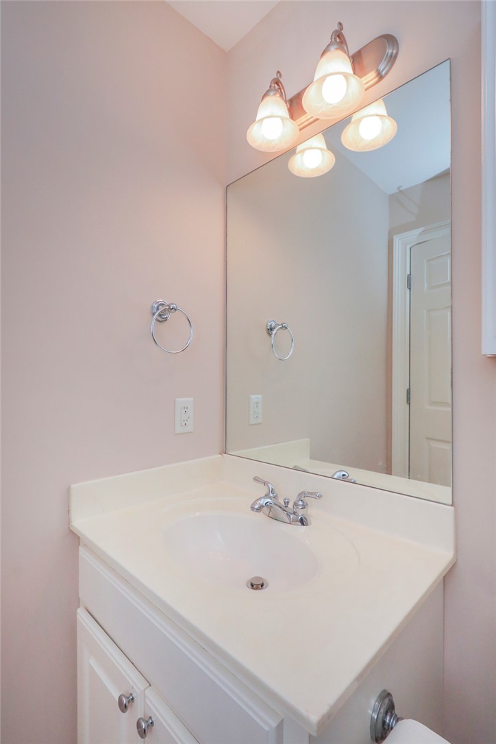 103 C-10-147D Anderson, SC 29621 - Photo 33 of 49 A well-lit vanity with a broad mirror anchors this functional bathroom space.