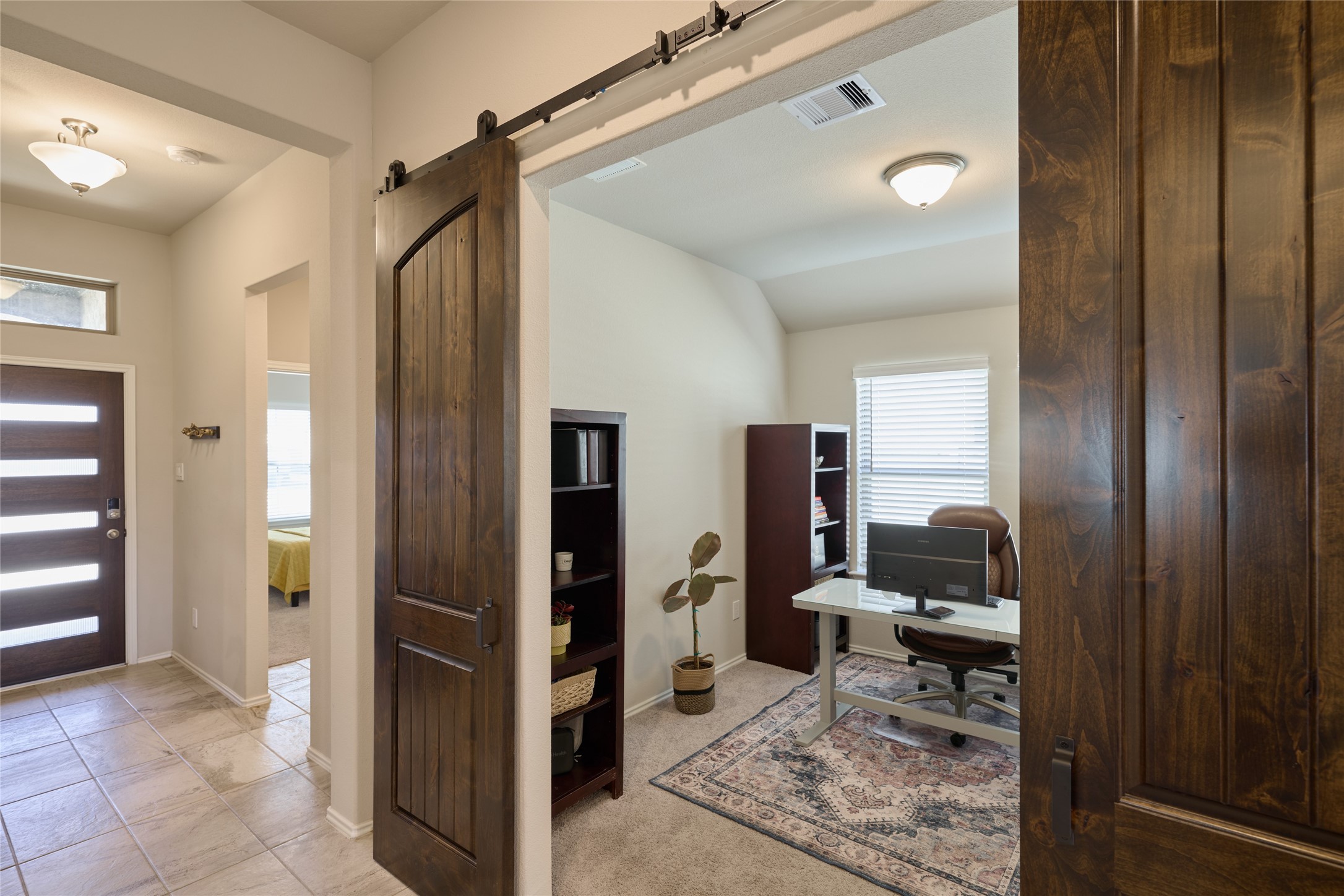 4523 Stone Ridge Lane Manvel, TX 77578 - Photo 12 of 44 Further down the hall is the flex room with barn doors to give you privacy if needed.