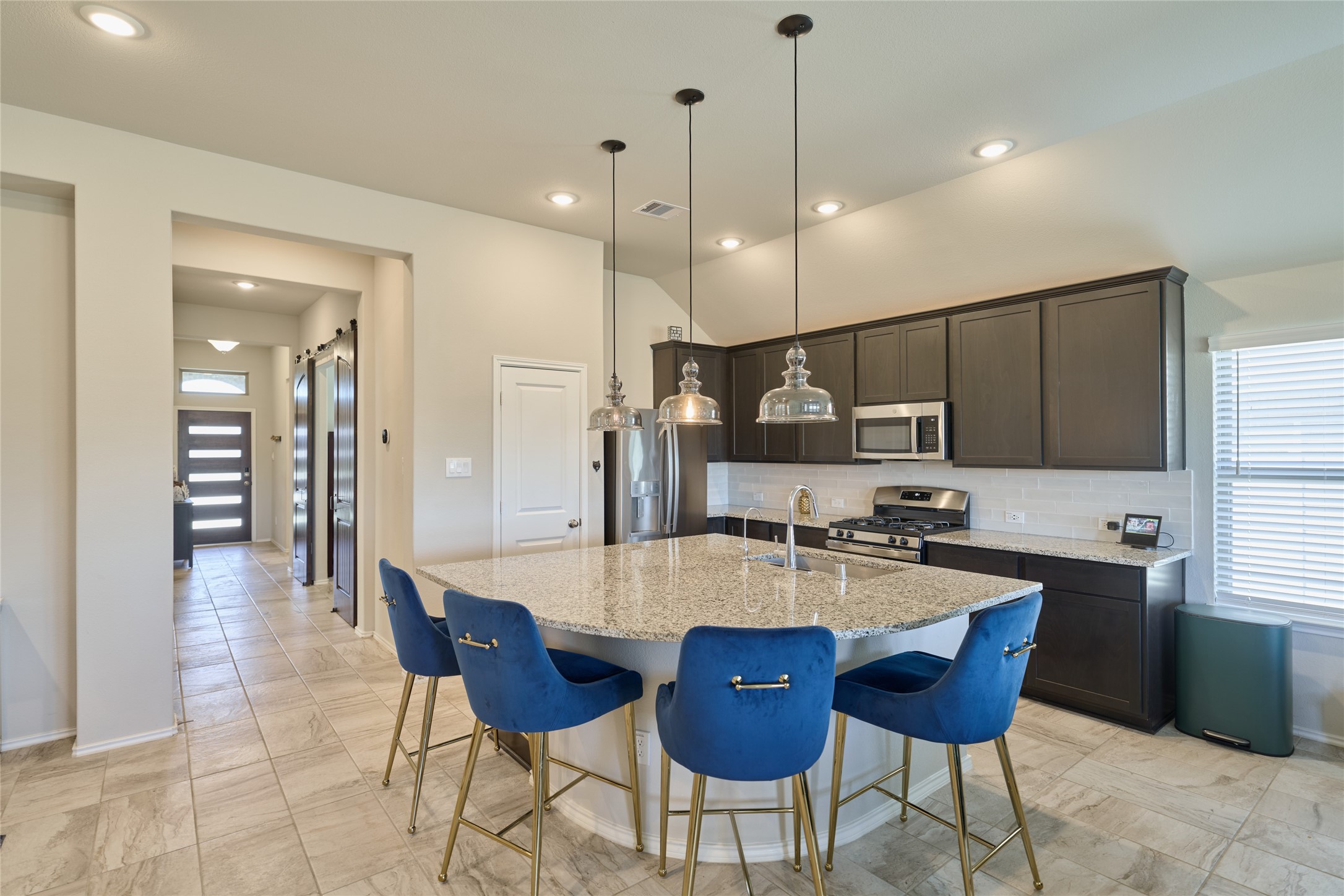 4523 Stone Ridge Lane Manvel, TX 77578 - Photo 15 of 44 This chef kitchen has a lot of cabinets and countertop space.