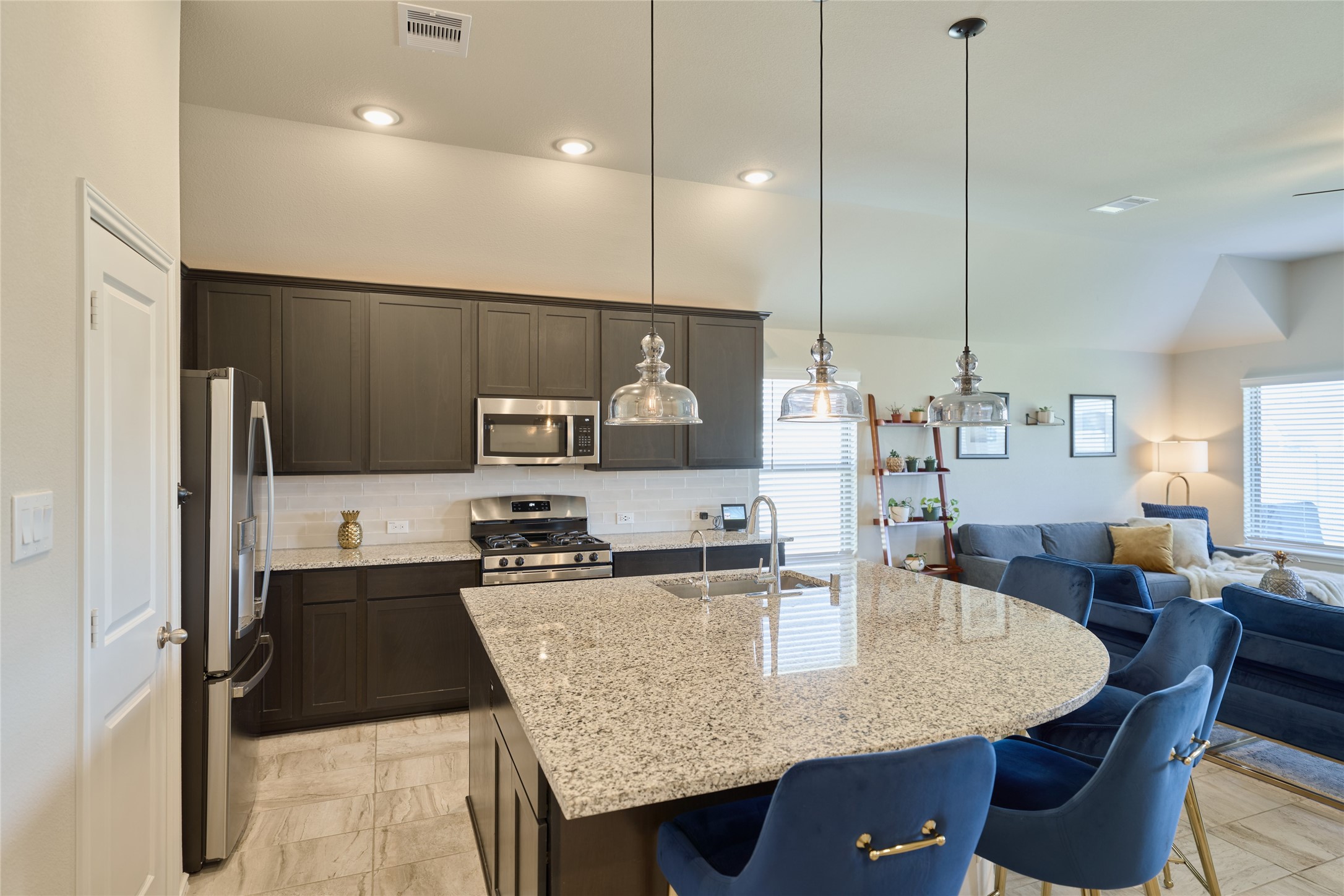 4523 Stone Ridge Lane Manvel, TX 77578 - Photo 19 of 44 The large kitchen island is not only great for prepping but it also provides extra seating for family and friends.