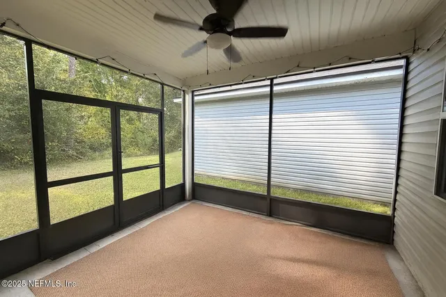 a view of a livingroom with a balcony