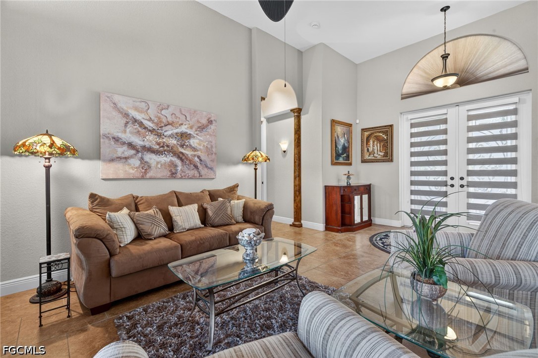 6109 Calusa Rdg Trail Bokeelia, FL 33922 - Photo 12 of 48 a living room with furniture ceiling fan and a rug