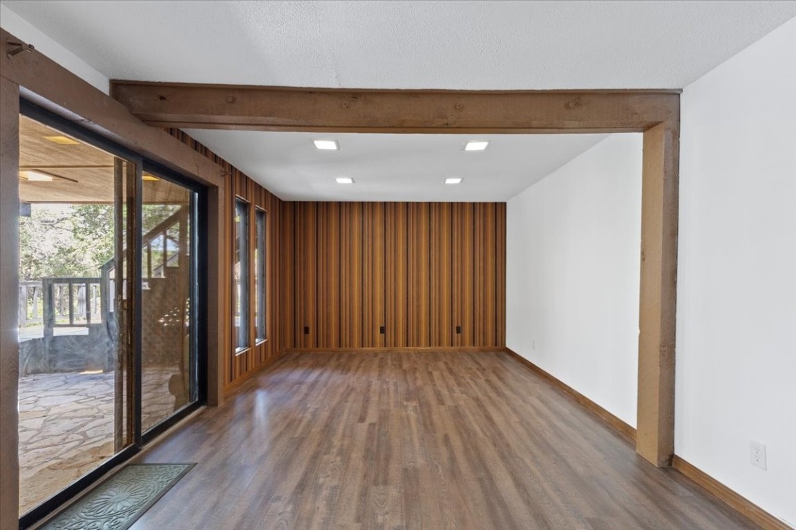 502 Grace Lane Austin, TX 78746 - Photo 9 of 37 wooden floor in an empty room with a window