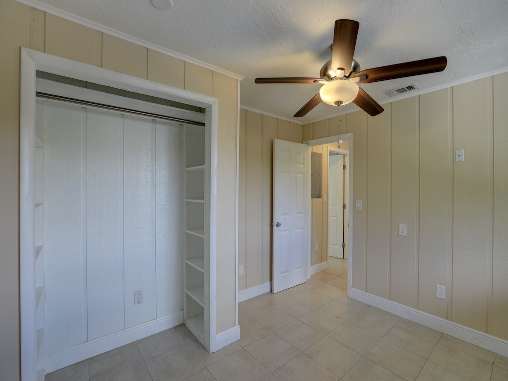 1840 Wabasso Beach Road Vero Beach, FL 32963 - Photo 16 of 22 a view of a hallway with a chandelier fan and closet area