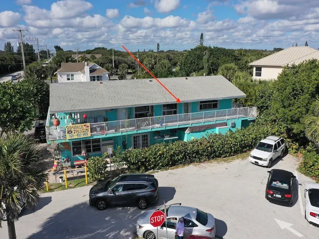 an aerial view of a house with a garden