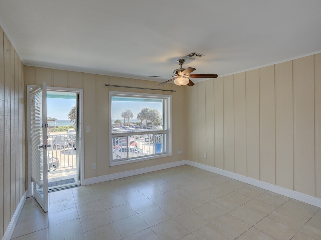 1840 Wabasso Beach Road Vero Beach, FL 32963 - Photo 5 of 22 wooden floor in an empty room with a window