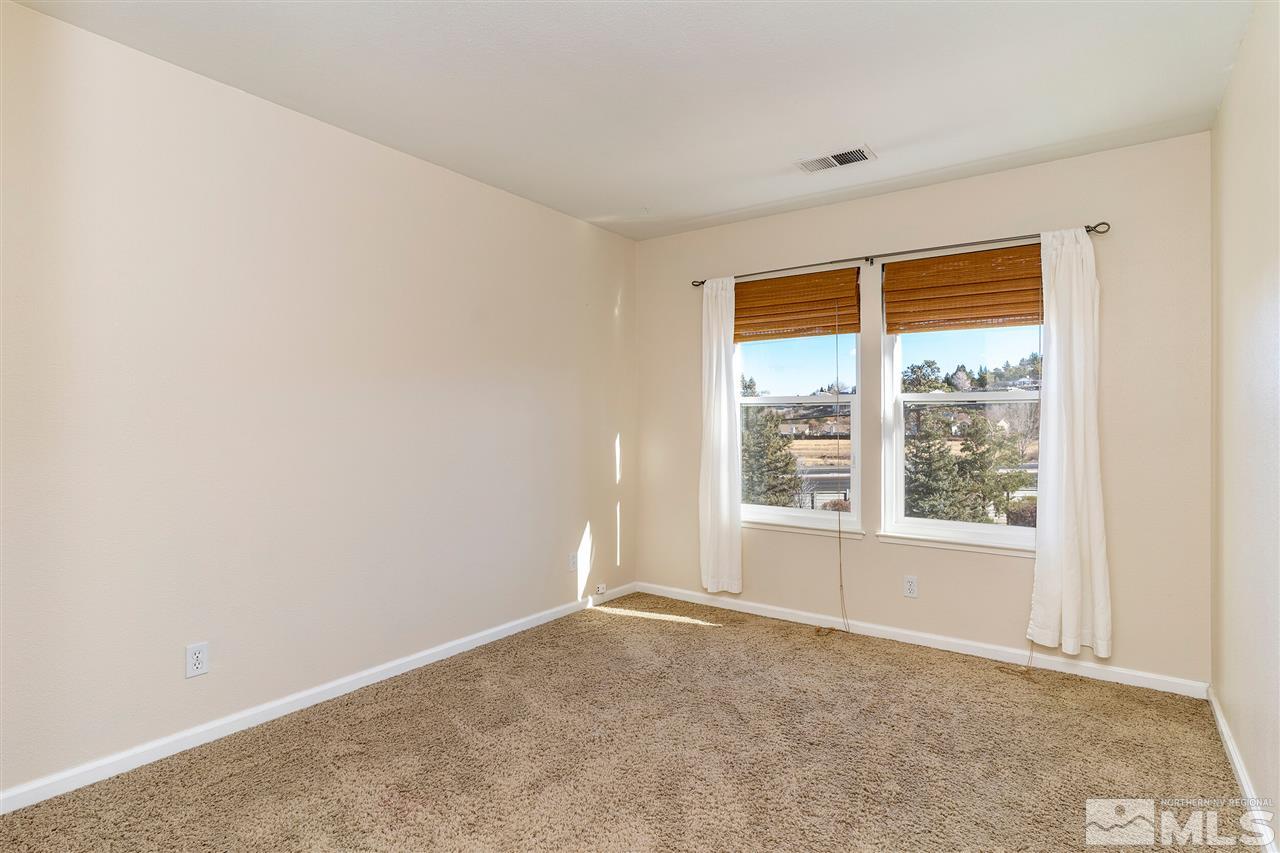 805 Caughlin Crossing Reno, NV 89519 - Photo 16 of 31 a view of an empty room with a window
