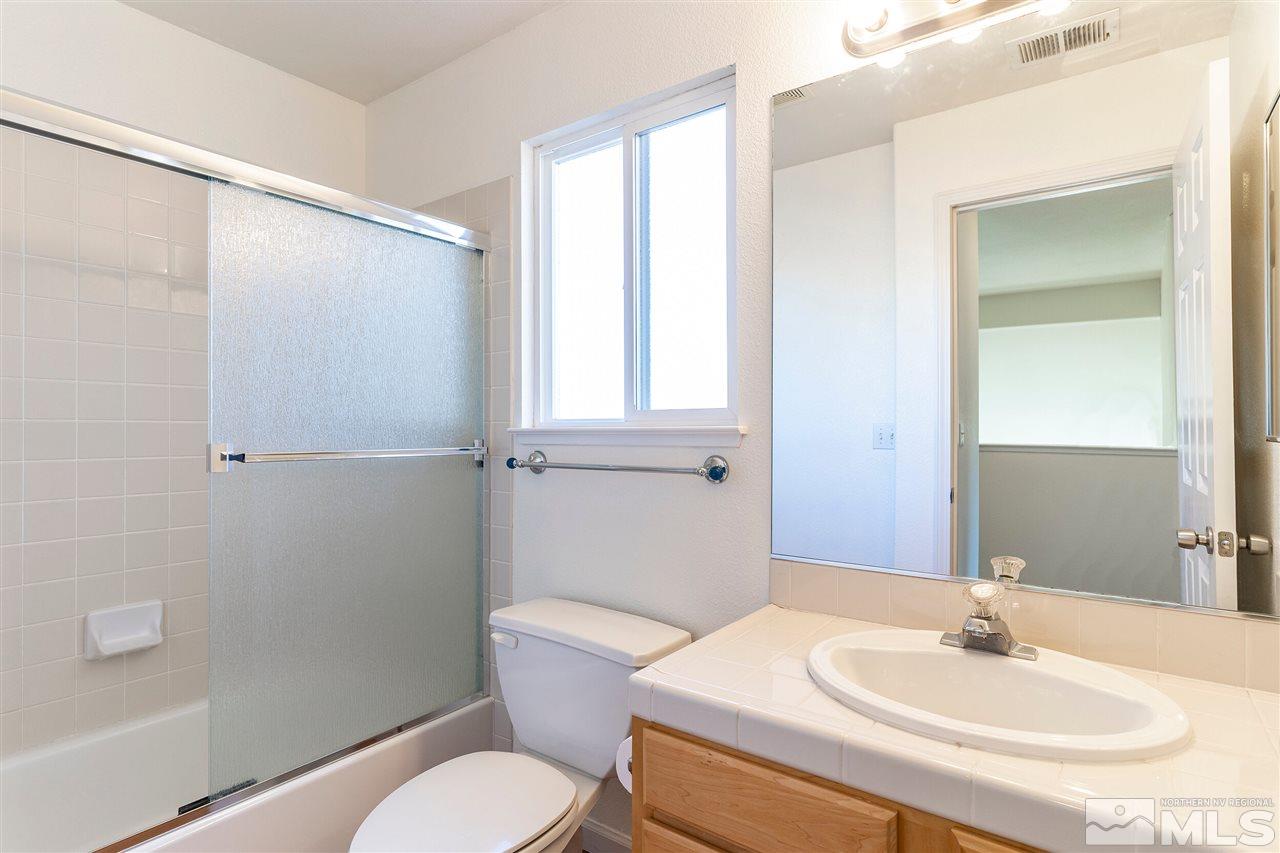 805 Caughlin Crossing Reno, NV 89519 - Photo 18 of 31 a bathroom with a sink toilet and mirror