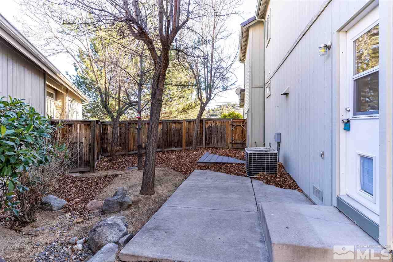 805 Caughlin Crossing Reno, NV 89519 - Photo 19 of 31 a view of a house with backyard and sitting area