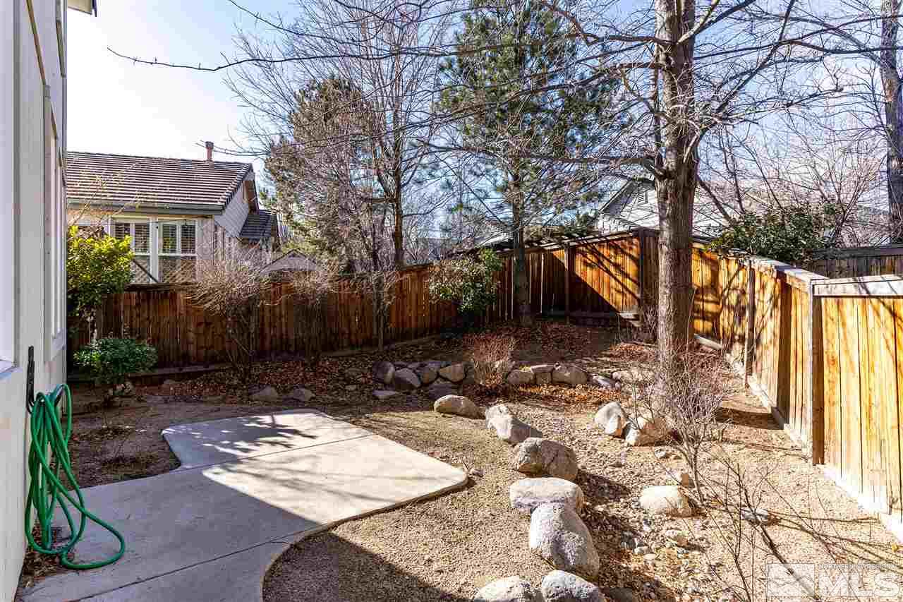 805 Caughlin Crossing Reno, NV 89519 - Photo 20 of 31 a view of a yard with plants and trees