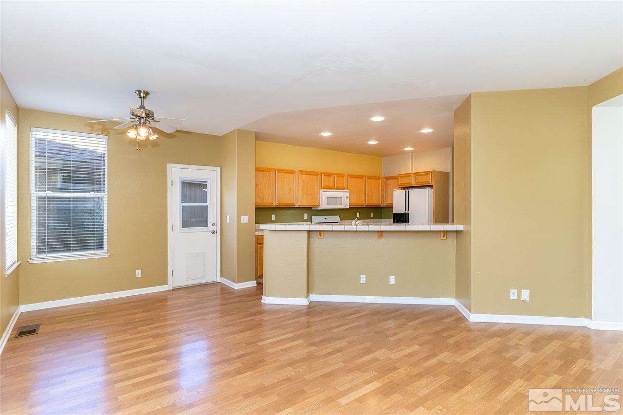 805 Caughlin Crossing Reno, NV 89519 - Photo 7 of 31 a view of a kitchen with a refrigerator and a window