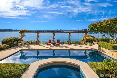 a view of swimming pool with outdoor seating