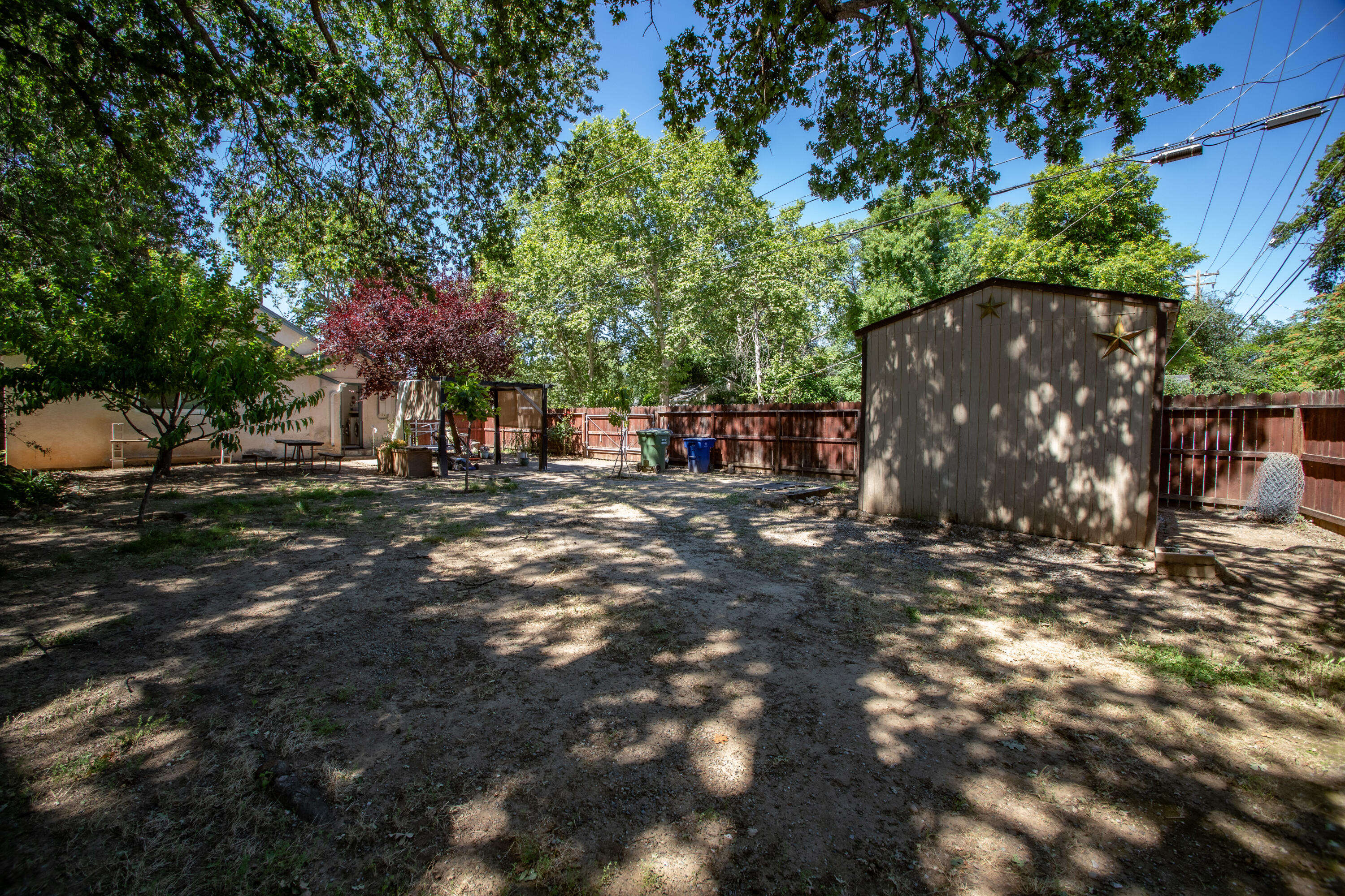 856 State Street Redding, CA 96001 - Photo 2 of 13 a view of outdoor space with deck and tree