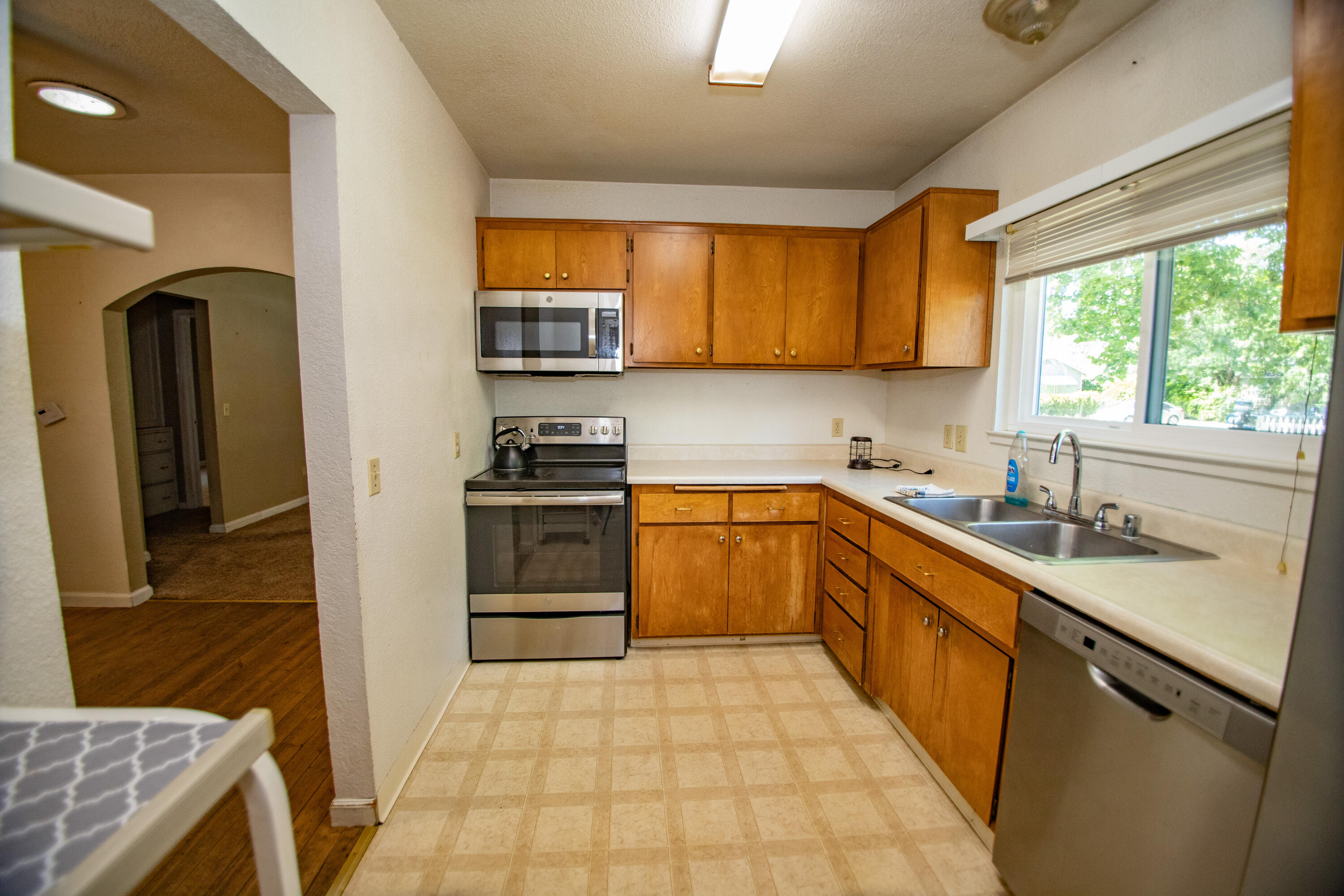 856 State Street Redding, CA 96001 - Photo 8 of 13 a kitchen with a sink stove and refrigerator