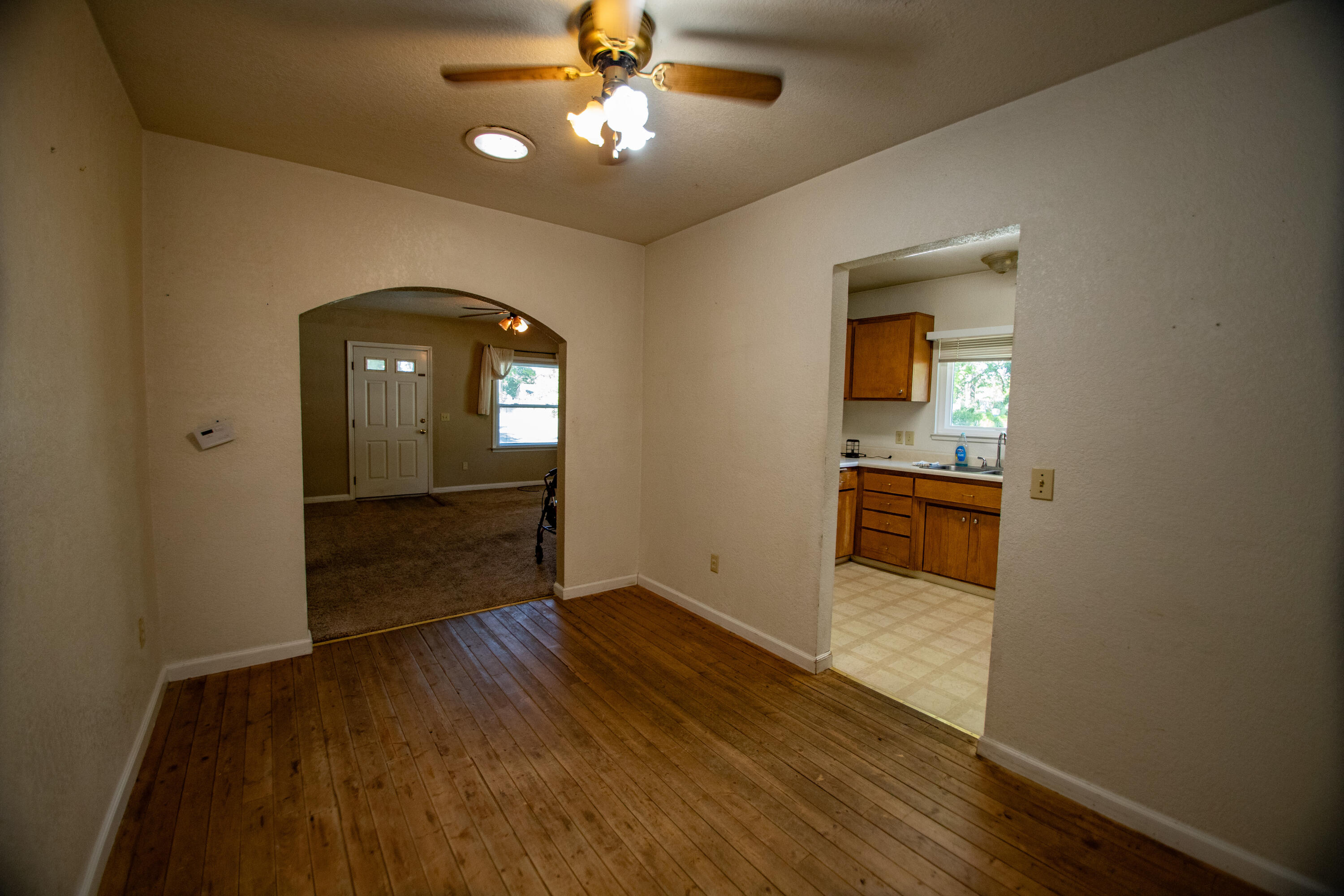 856 State Street Redding, CA 96001 - Photo 10 of 13 wooden floor in an empty room with a window