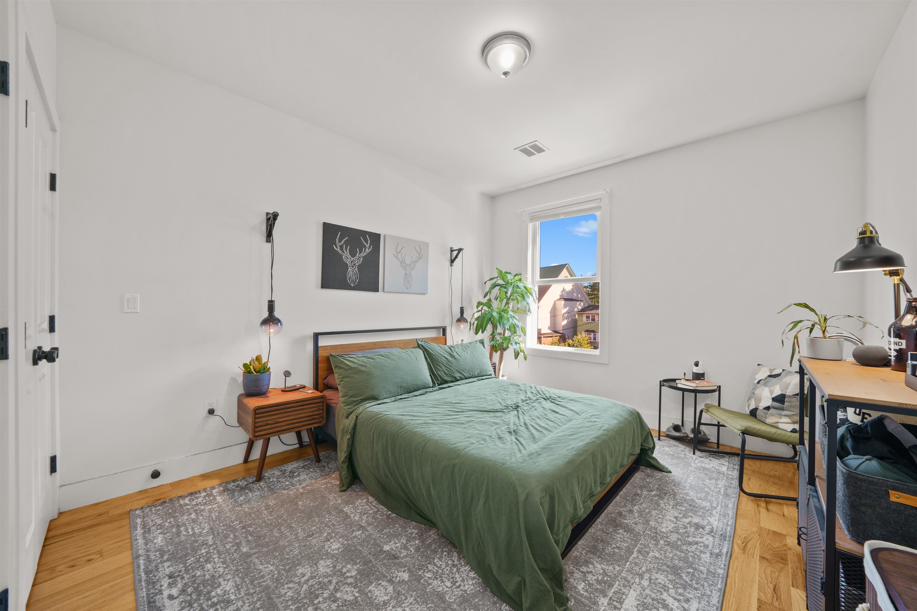 34 Van Reypen Street, Unit 2 Jersey City, NJ 07306 - Photo 11 of 25 a bedroom with a bed and a desk