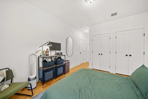 a bedroom with furniture and natural light