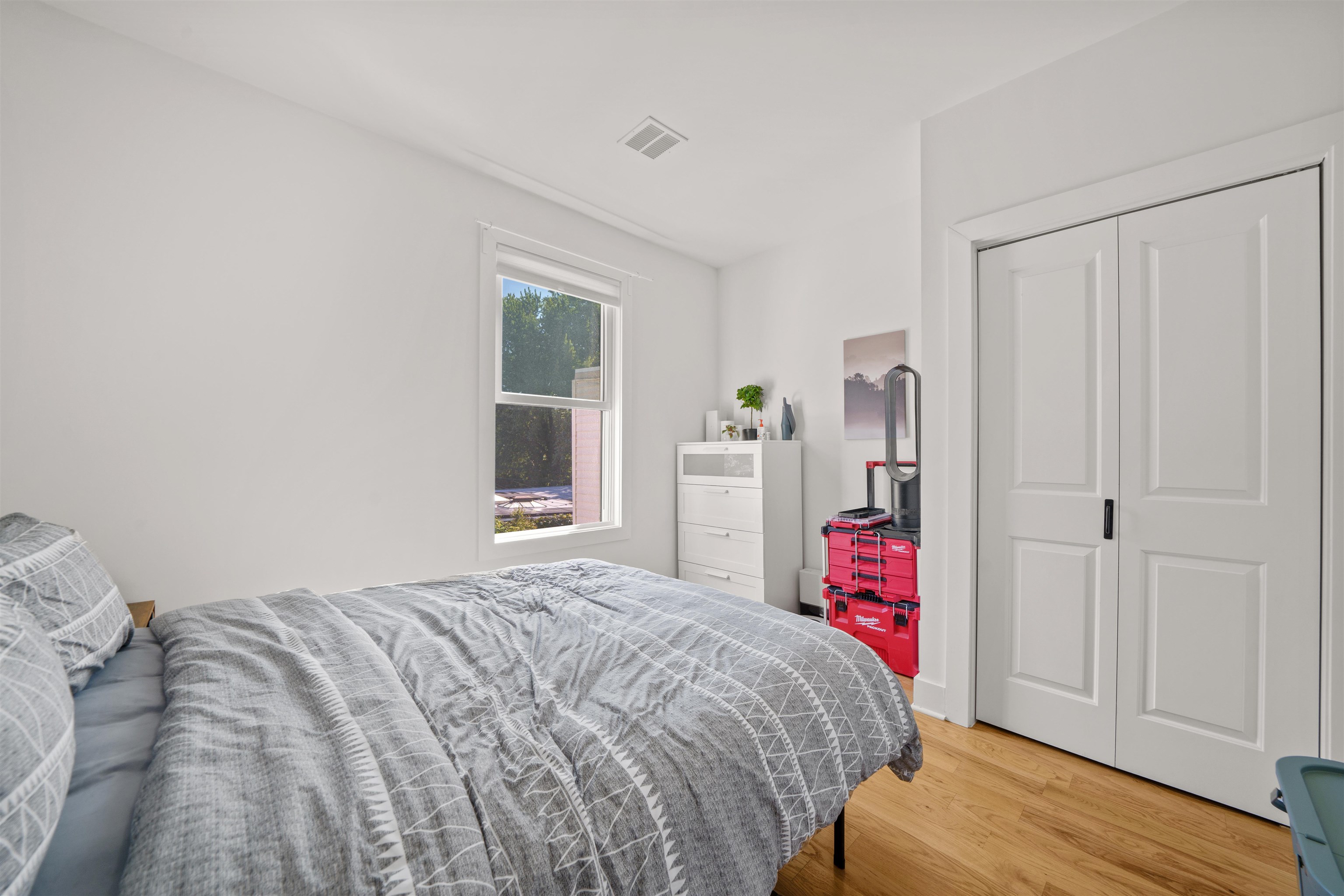 34 Van Reypen Street, Unit 2 Jersey City, NJ 07306 - Photo 16 of 25 a bedroom with a bed and a window