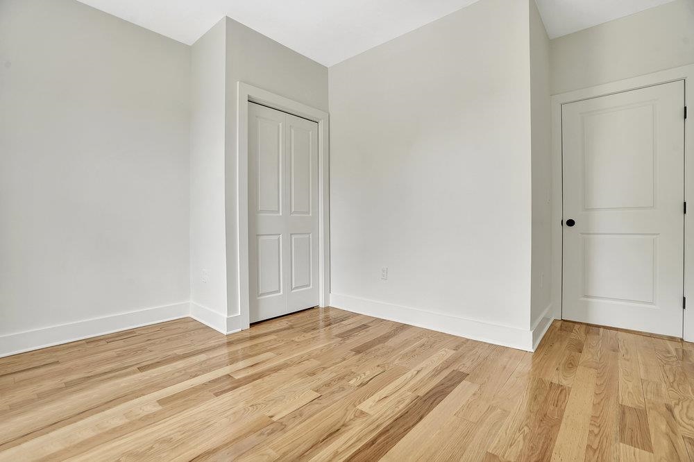 34 Van Reypen Street, Unit 2 Jersey City, NJ 07306 - Photo 17 of 25 a view of empty room with wooden floor