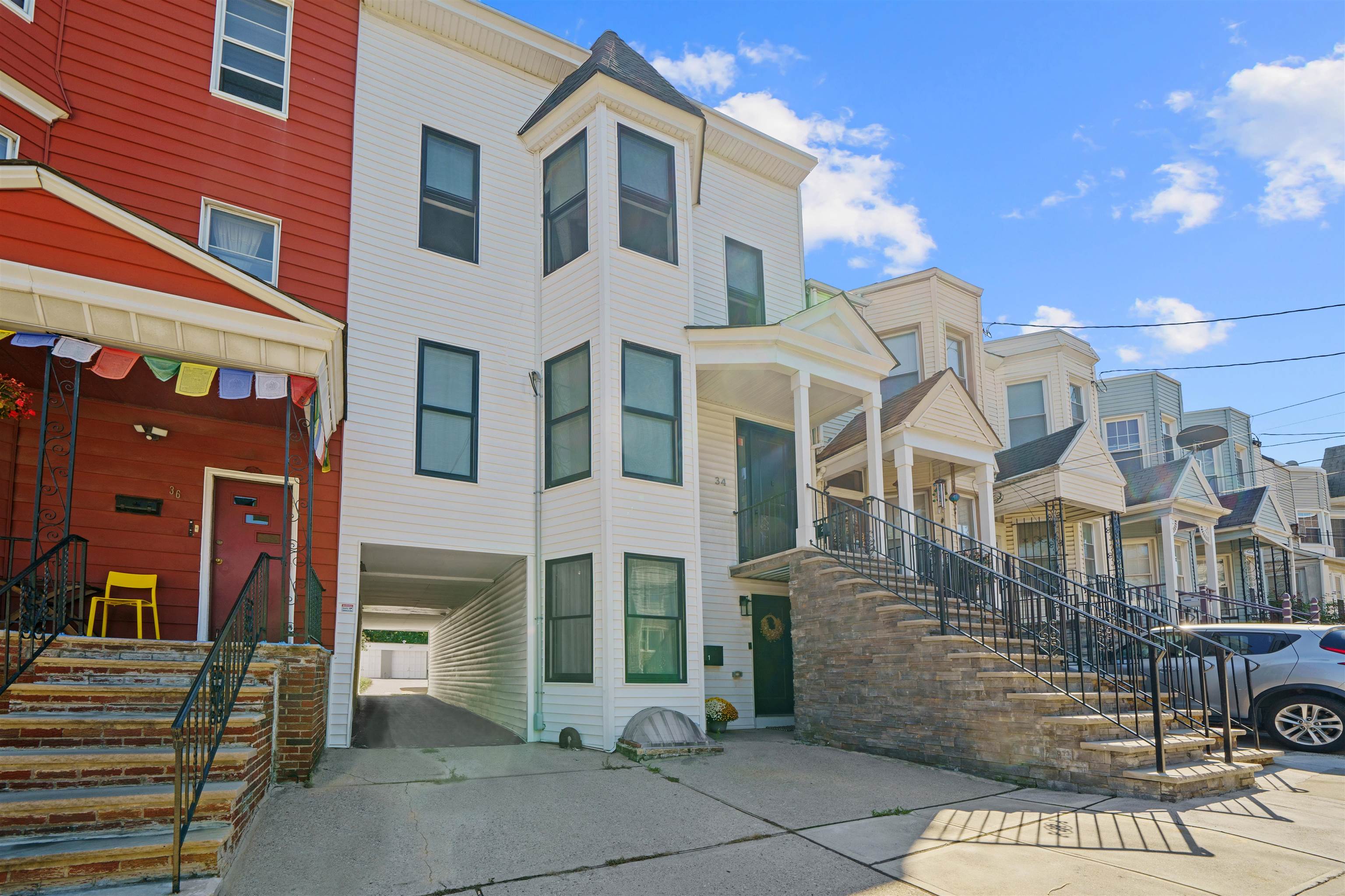 34 Van Reypen Street, Unit 2 Jersey City, NJ 07306 - Photo 2 of 25 a front view of a multi story residential apartment building