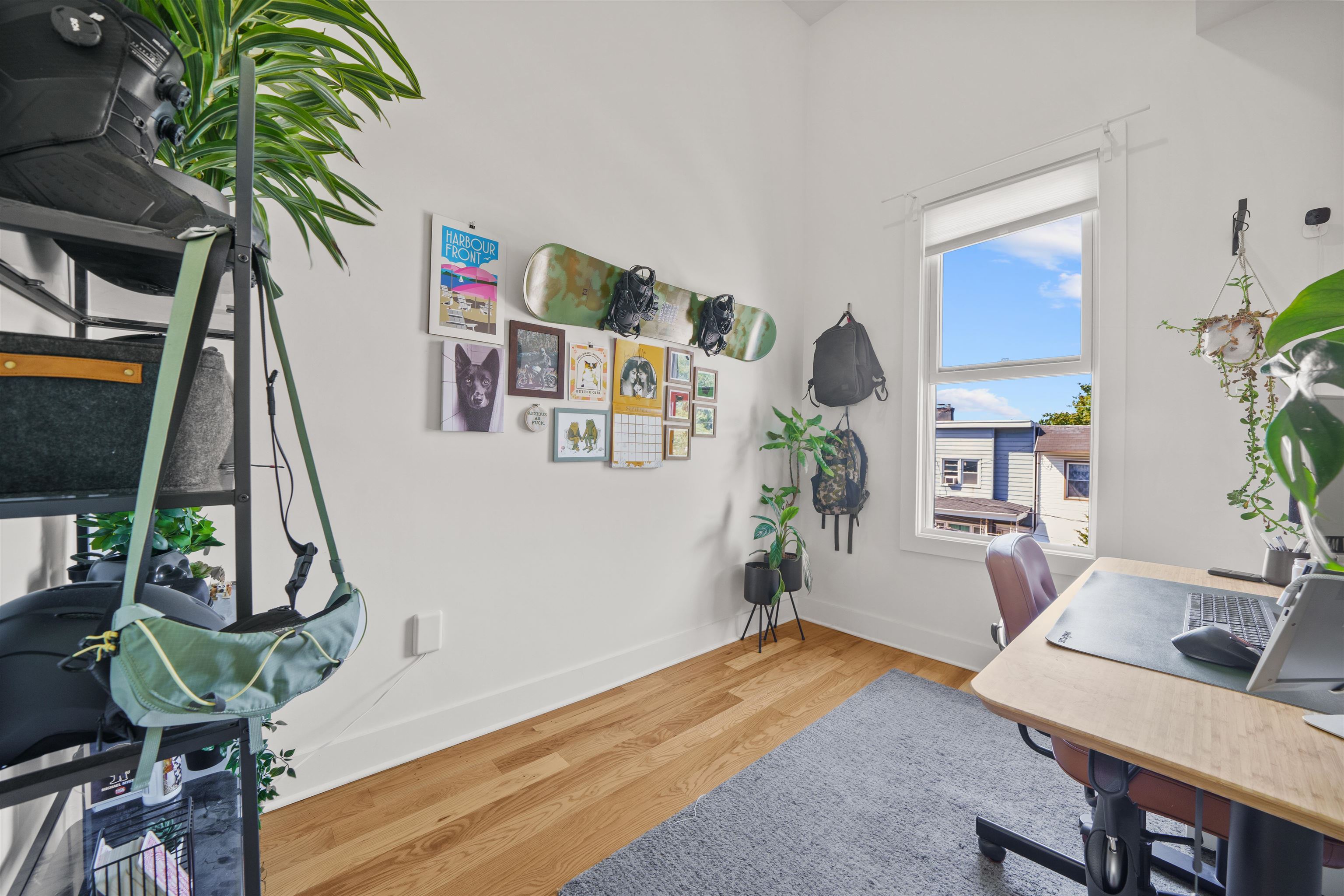 34 Van Reypen Street, Unit 2 Jersey City, NJ 07306 - Photo 23 of 25 a living room with furniture and a potted plant