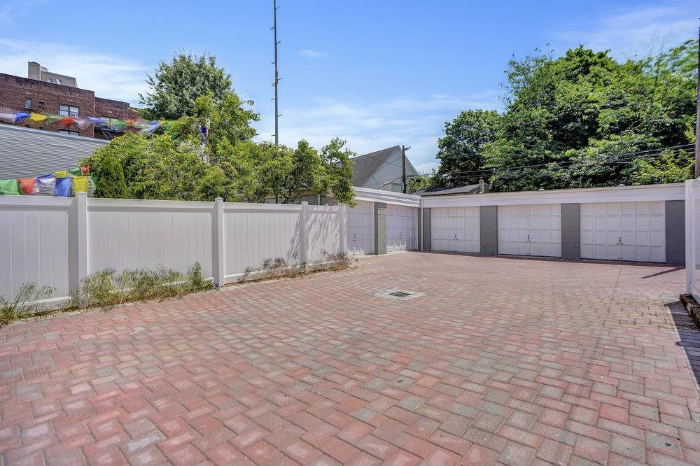 34 Van Reypen Street, Unit 2 Jersey City, NJ 07306 - Photo 24 of 25 a view of backyard and tree
