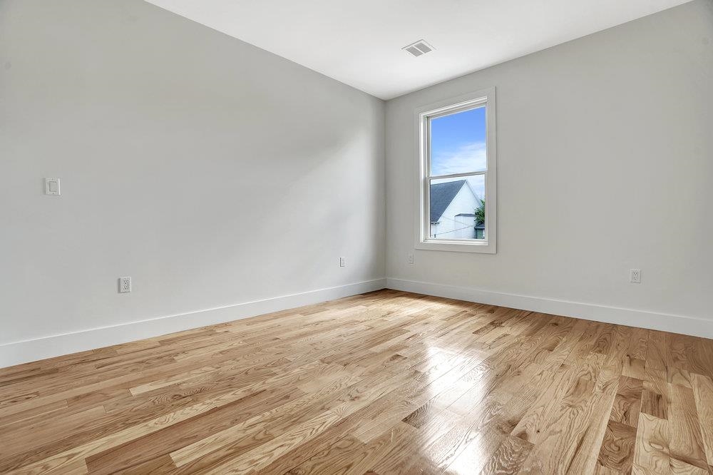 34 Van Reypen Street, Unit 2 Jersey City, NJ 07306 - Photo 10 of 25 a view of an empty room and window