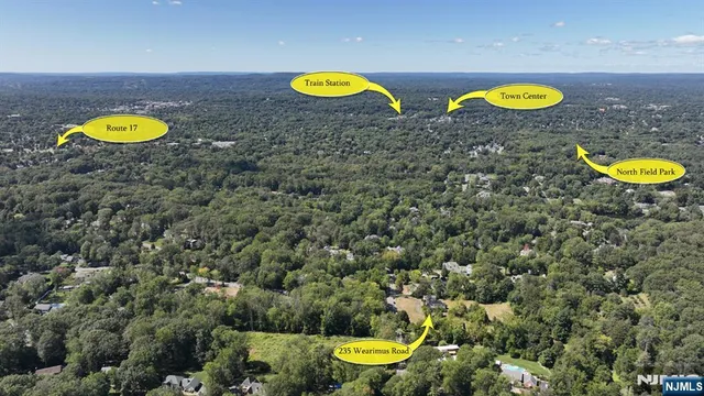 a view of a swimming pool with a table and chairs