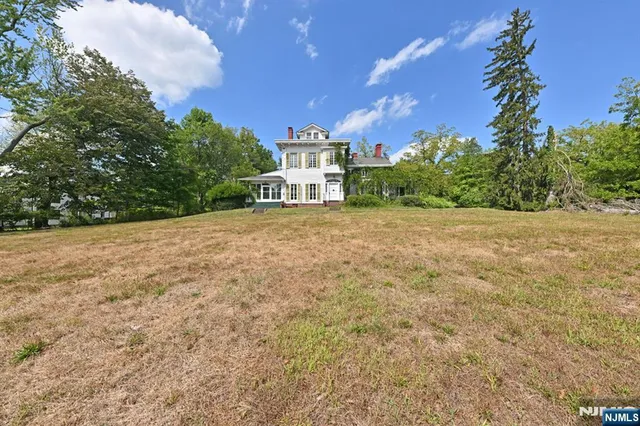 a view of a house with a big yard