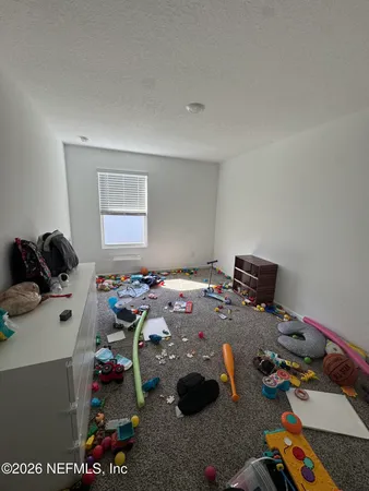 a bed room with a bed and a couch