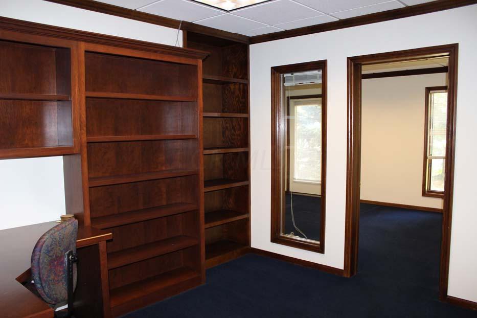 1900 Bethel Road Columbus, OH 43235 - Photo 13 of 24 New blue carpet ~02. Ivory painted walls. Suspended ceiling. Fluorescent lighting. Built-in bookcases. Crown molding. Access to Executive Office and Office #2.