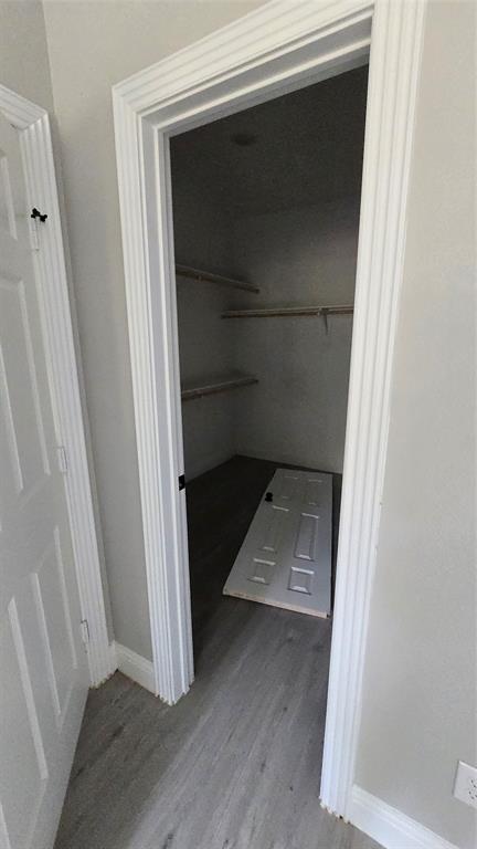 228 East Acres Road Gun Barrel City, TX 75156 - Photo 13 of 25 a view of walk in closet with empty racks