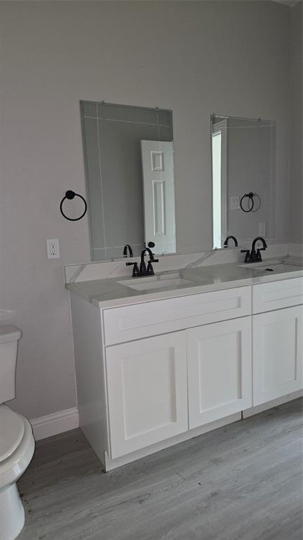 228 East Acres Road Gun Barrel City, TX 75156 - Photo 16 of 25 a bathroom with a sink and a toilet