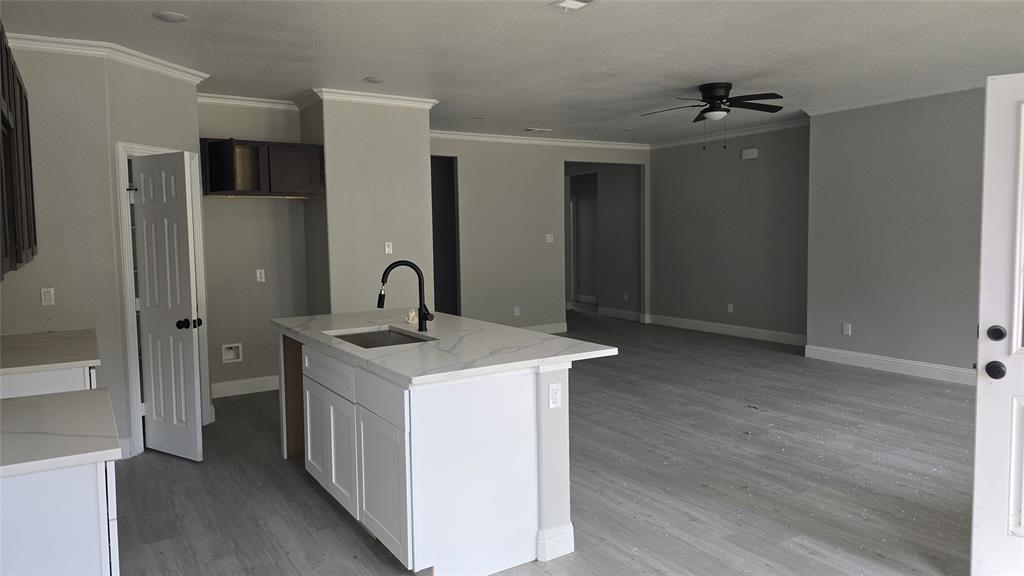 228 East Acres Road Gun Barrel City, TX 75156 - Photo 2 of 25 a kitchen that has a sink and a stove in it