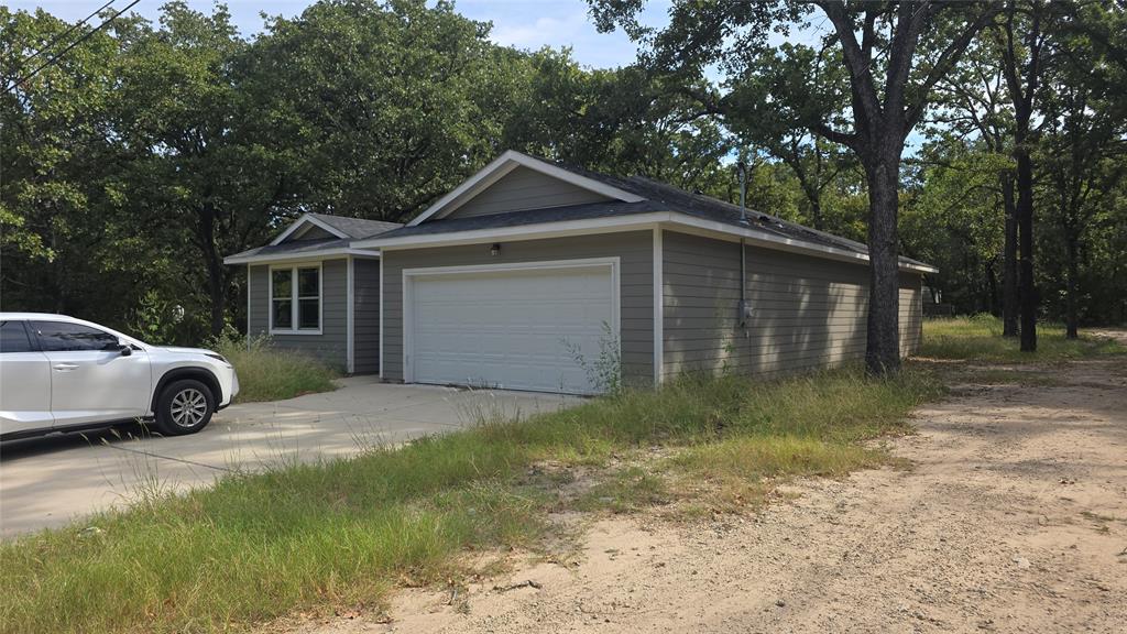 228 East Acres Road Gun Barrel City, TX 75156 - Photo 23 of 25 a view of a house with a yard